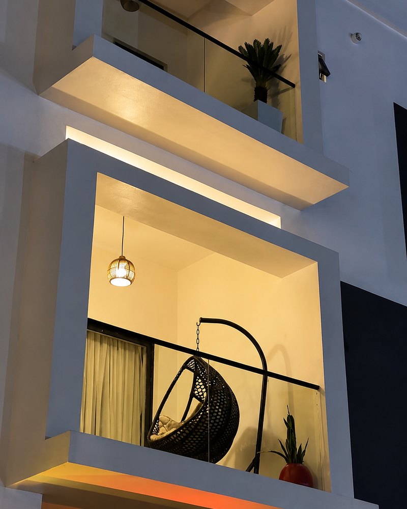 A lit balcony on the residence
